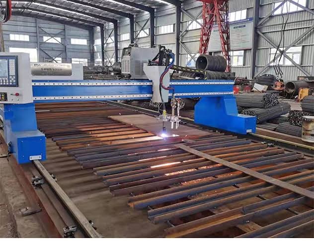 CNC gantry cutting machine with sparks flying during MS plate cutting at Dee Kay Traders Ghaziabad